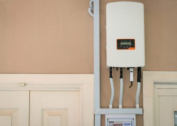 Solar,Inverter,Mounted,On,The,Wall,Of,A,Residential,Home.